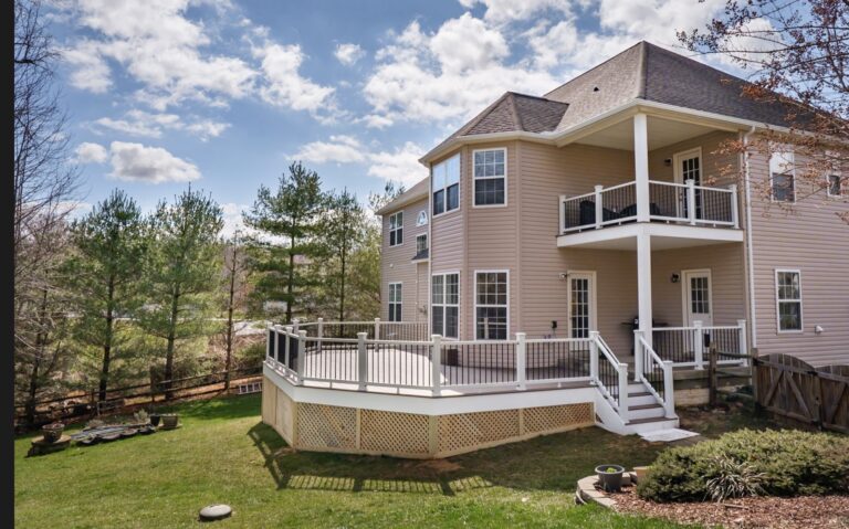 Angled deck with white rail and stairs — Fredericksburg Deck Builders
