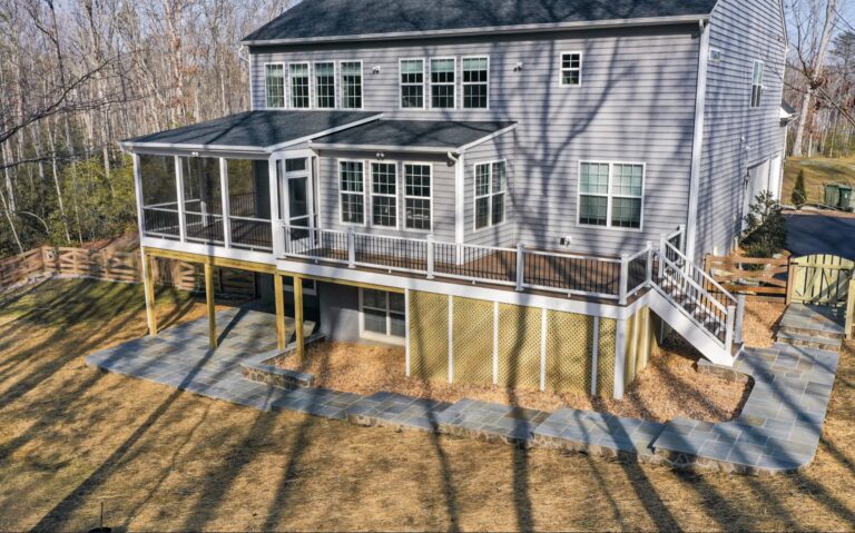 Covered porch and elevated deck on a gray home — Fredericksburg Deck Builders