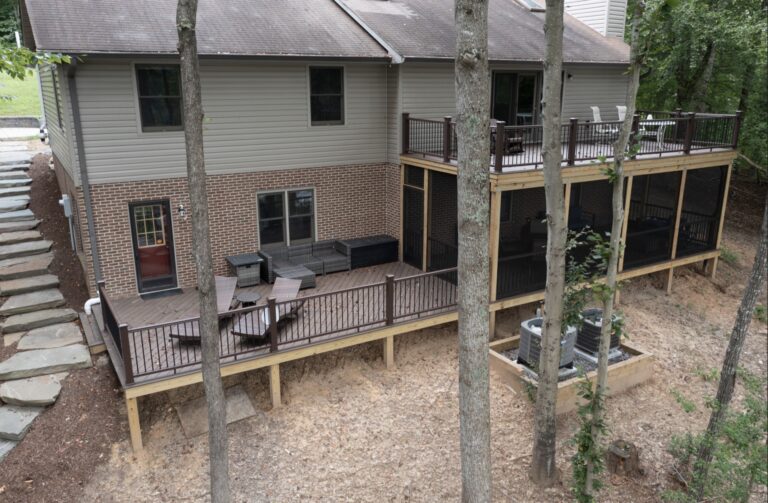 Dark deck with covered porch and black rail — Fredericksburg Deck Builders