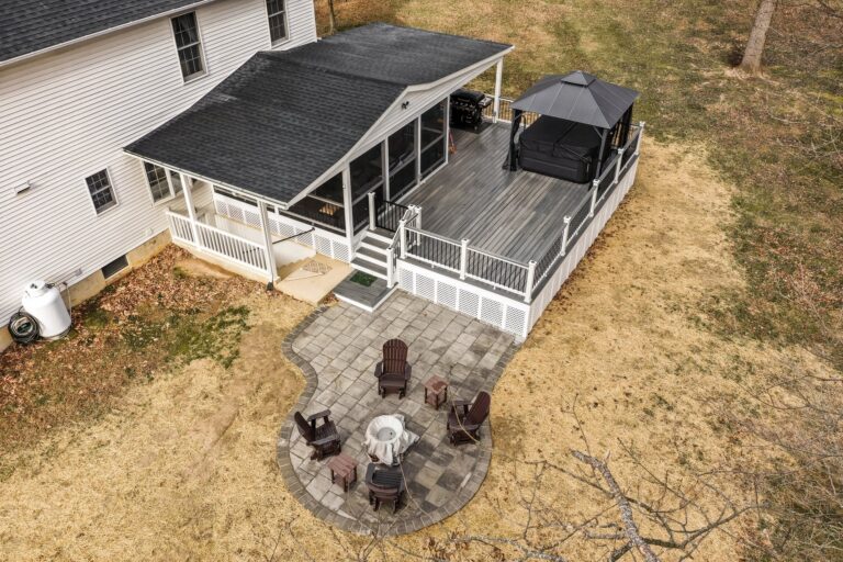 Covered porch with a recessed hot tub, paver patio and fire pit — Fredericksburg Deck Builders