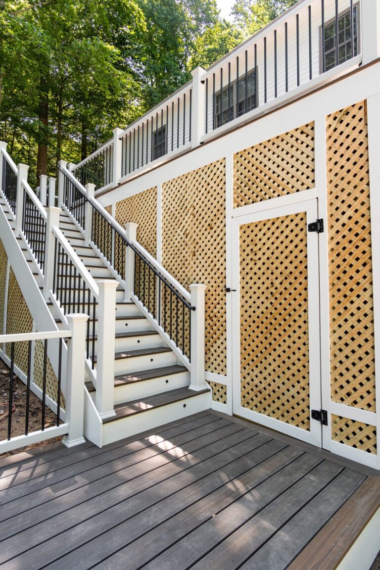 White stair railing with lattice skirting — deck railing by Fredericksburg Deck Builders, Fredericksburg VA