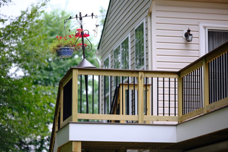 Wood deck railing with black balusters — deck railing by Fredericksburg Deck Builders, Fredericksburg VA