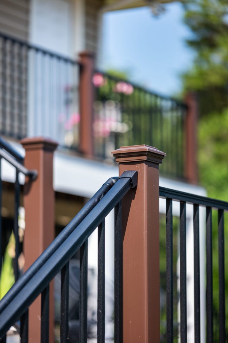 Brown rail post with black balusters, detail — deck railing by Fredericksburg Deck Builders, Fredericksburg VA